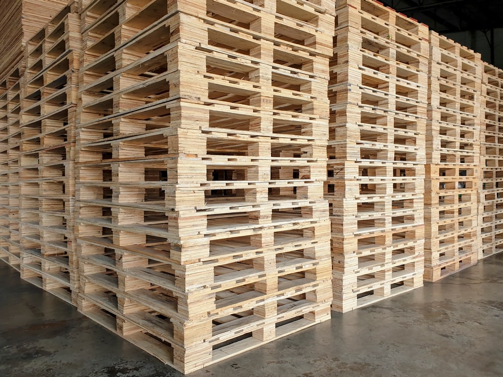 stack-wooden-pallets-indutrial-transport-min